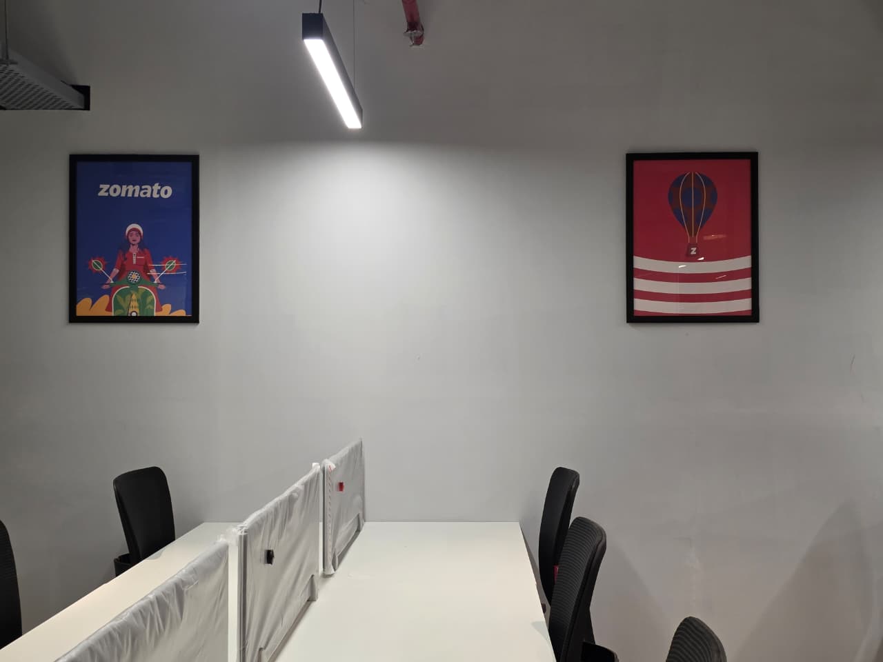 Eternal Coworking — open desks with industrial lighting