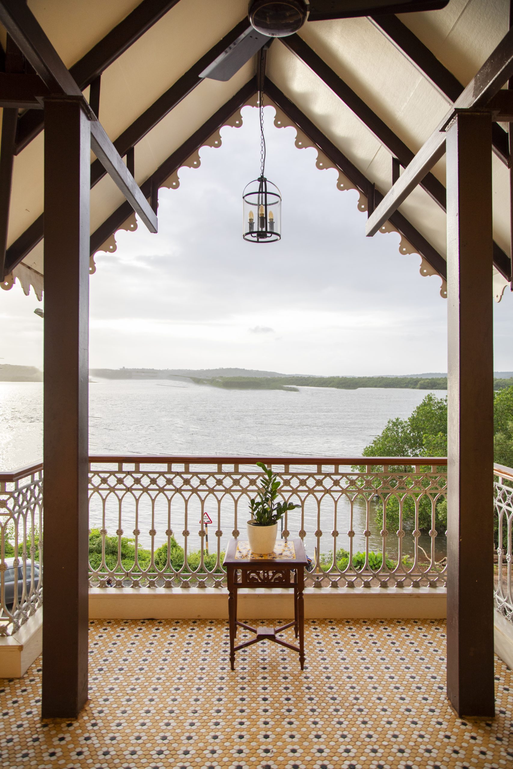 Casa Bella Vue — sunlit riverside verandah overlooking the Mandovi